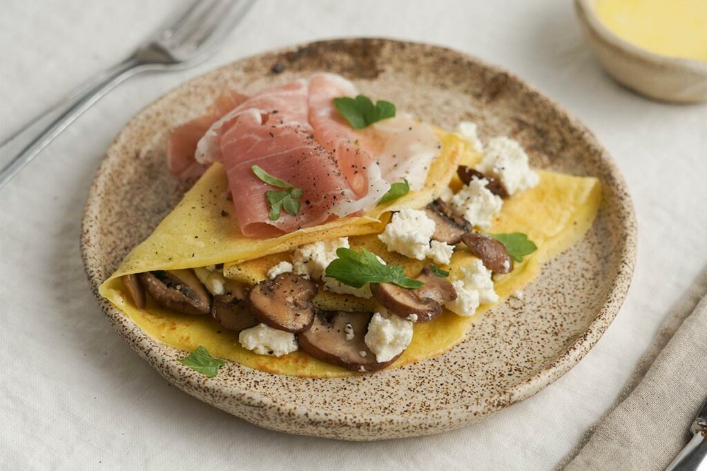 Ricetta delle crêpes con Prosciutto di San Daniele, funghi e ricotta